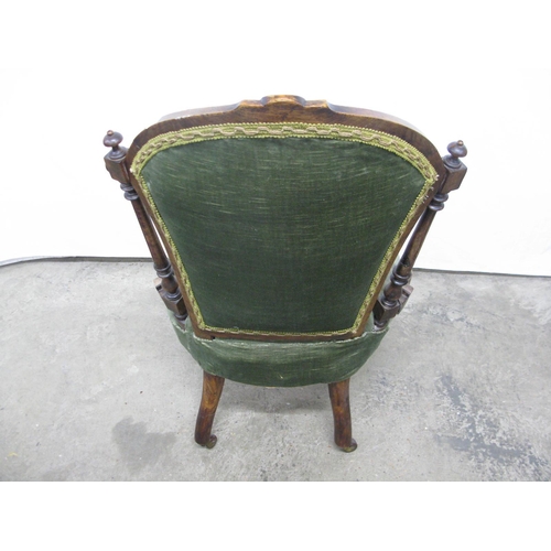 435 - Carved green upholstered nursing chair having button back and padded seat, standing on turned front ... 