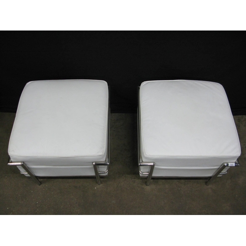 436 - Pair of Le Corbusier LC2 style stools having white padded leatherette seats with tubular chromed met... 