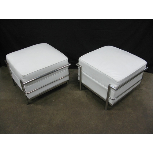 436 - Pair of Le Corbusier LC2 style stools having white padded leatherette seats with tubular chromed met... 