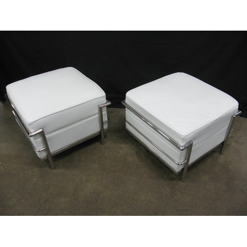 436 - Pair of Le Corbusier LC2 style stools having white padded leatherette seats with tubular chromed met... 