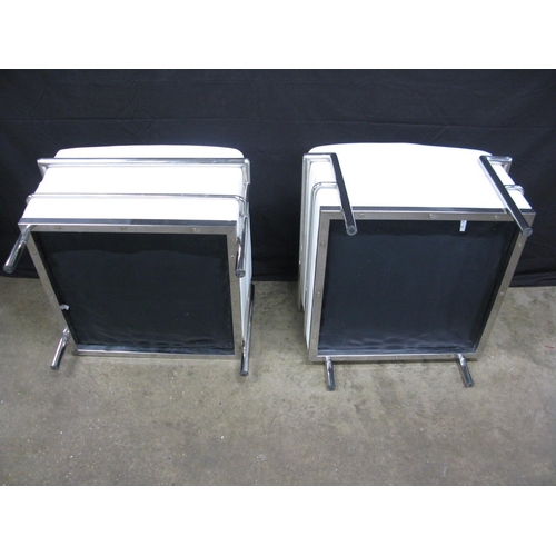 436 - Pair of Le Corbusier LC2 style stools having white padded leatherette seats with tubular chromed met... 