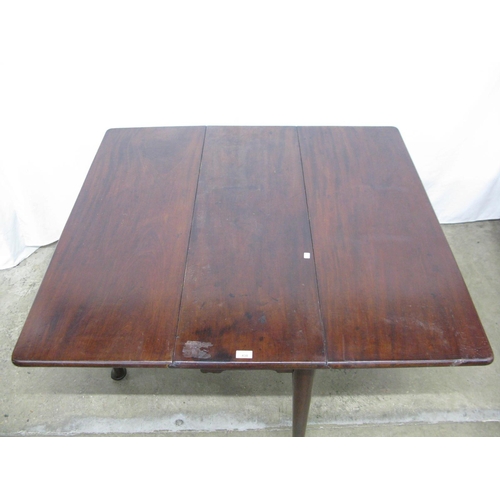 438 - Mahogany drop leaf table, the rectangular top standing on round tapering supports with pad feet - 41... 