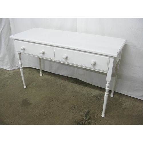 439 - Modern white painted two drawer side table, standing on turned legs - 122cm x 46cm x 76cm tall