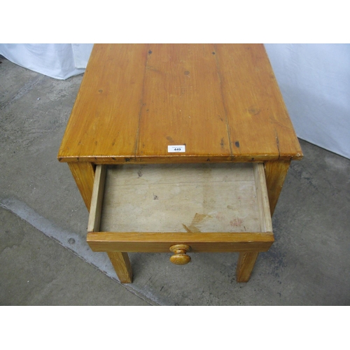 449 - Stained pine table, the three plank top over a single drawer, standing on square tapering legs - 56c... 