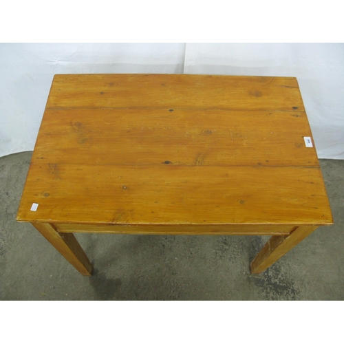 449 - Stained pine table, the three plank top over a single drawer, standing on square tapering legs - 56c... 