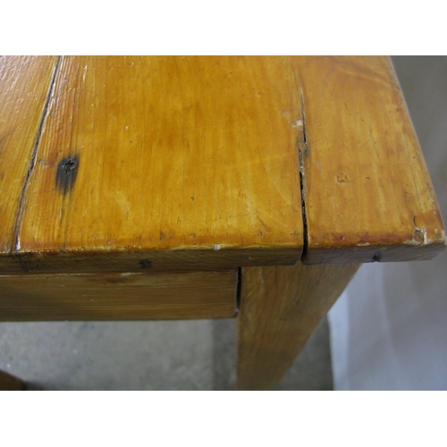 449 - Stained pine table, the three plank top over a single drawer, standing on square tapering legs - 56c... 