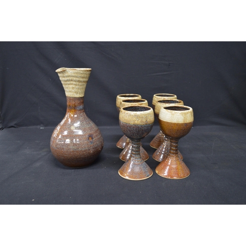 47 - Pottery vase by JS Ceramics together with a set of six pottery goblets and a table lamp having cut g... 