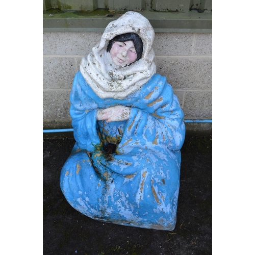 6 - Fiberglass statue of a seated lady in blue clothing with white head scarf - 95cm tall