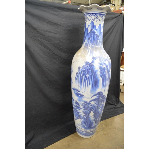 94 - Large late 20th century blue and white floor vase decorated with trees - 183cm tall