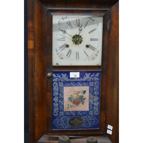 98 - Mahogany framed American wall clock with Roman Numerals on a white ground and floral face, over a bl... 