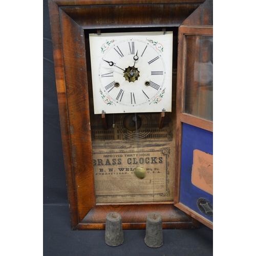 98 - Mahogany framed American wall clock with Roman Numerals on a white ground and floral face, over a bl... 