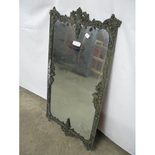 121 - Gilt metal mirror with floral scrolled decoration - 46cm x 82cm tall