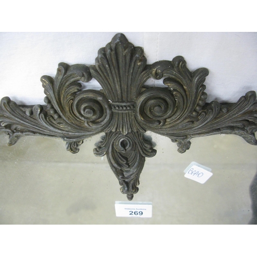 121 - Gilt metal mirror with floral scrolled decoration - 46cm x 82cm tall