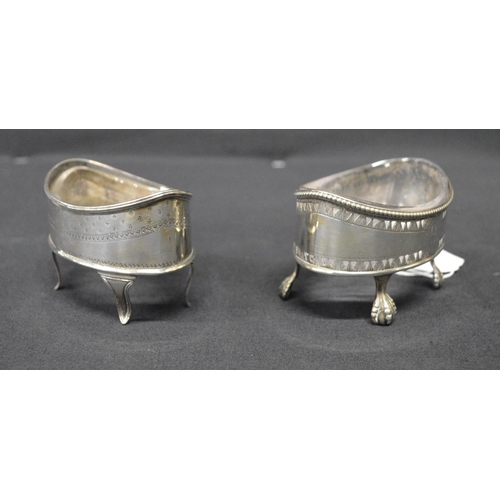 144 - Two Georgian silver salts of oval form with clear glass liners