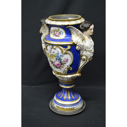 30 - Continental porcelain oil lamp base decorated with panels of flowers on a blue ground with gilt high... 