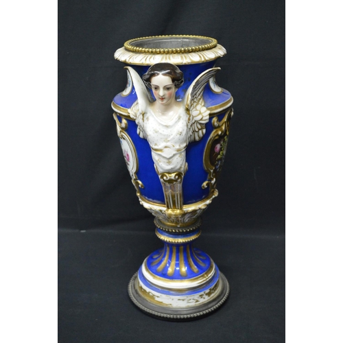 30 - Continental porcelain oil lamp base decorated with panels of flowers on a blue ground with gilt high... 