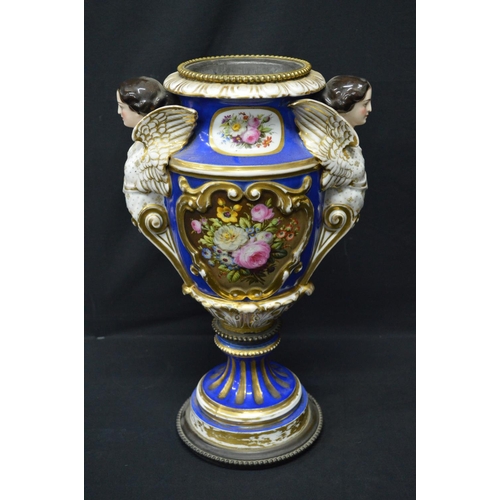 30 - Continental porcelain oil lamp base decorated with panels of flowers on a blue ground with gilt high... 