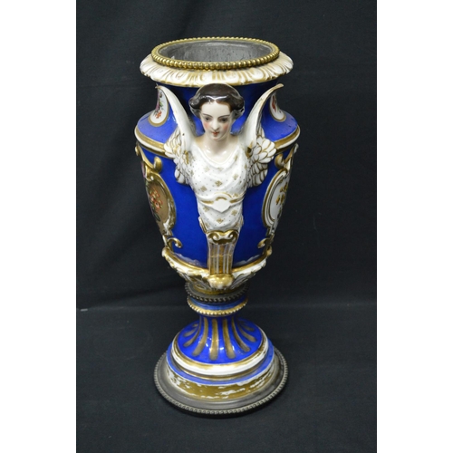 30 - Continental porcelain oil lamp base decorated with panels of flowers on a blue ground with gilt high... 