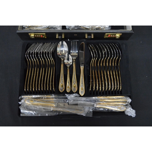 32 - SBS-Bestecke twelve place setting cutlery set housed in lockable brief case