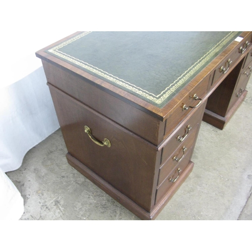 479 - Hampton & Sons twin pedestal desk having inset leather top over an arrangement of nine drawers, with... 