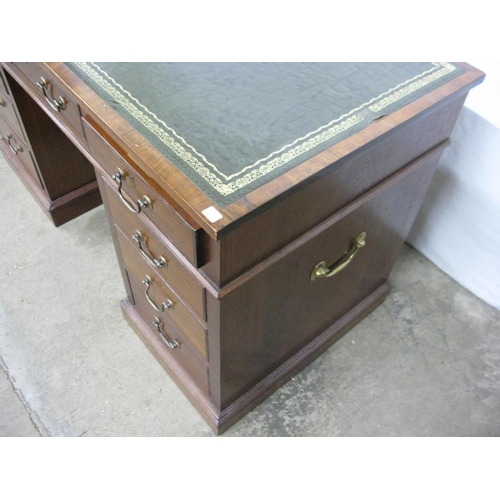 479 - Hampton & Sons twin pedestal desk having inset leather top over an arrangement of nine drawers, with... 