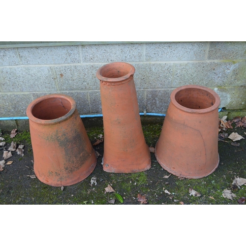 7 - Two terracotta rhubarb forcers - 51.5cm tall together with a chimney pot - 74cm tall