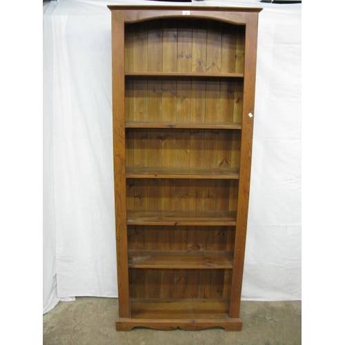 362 - Pine open bookshelves having a shaped frieze over five shelves, standing on plinth base - 84cm x 26.... 