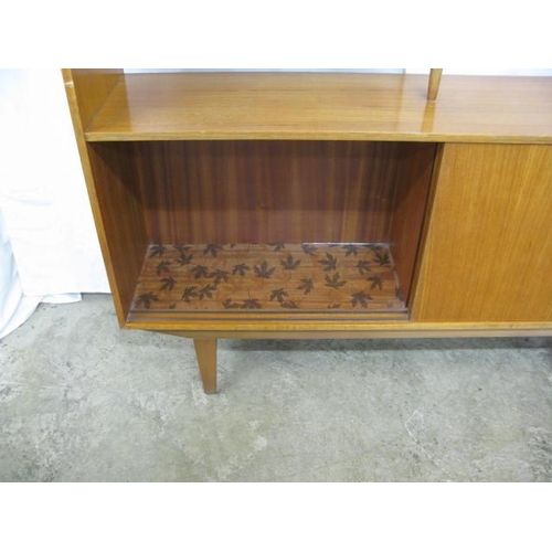 365 - Mid century teak room divider having a central shelf with two half shelves united by turned tapering... 