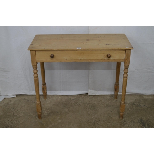 370 - Pine side table having a single long drawer, standing on turned legs - 89cm x 43.5cm x 74cm tall