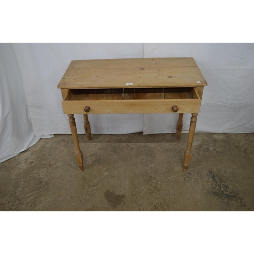 370 - Pine side table having a single long drawer, standing on turned legs - 89cm x 43.5cm x 74cm tall