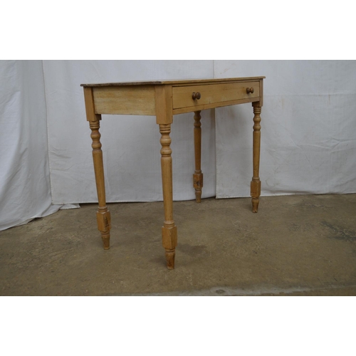 370 - Pine side table having a single long drawer, standing on turned legs - 89cm x 43.5cm x 74cm tall