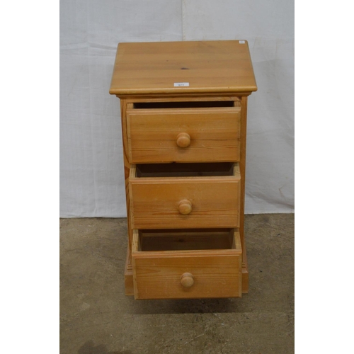 371 - Pine bedside chest of three small drawers, standing on a plinth base - 38cm x 34cm x 66cm tall