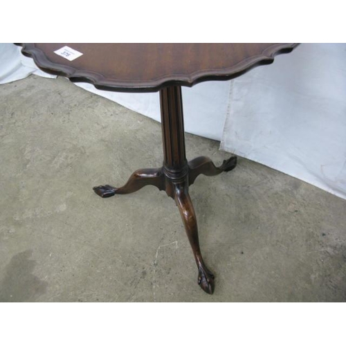 376 - Inlaid mahogany wine table, the pie crust top over a tapering fluted column, standing on splayed tri... 