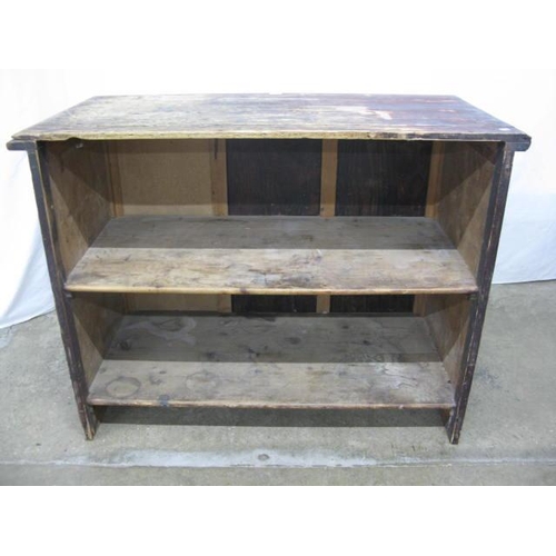 384 - Pine and ply shop counter, the rectangular top over an open back fitted with two shelves and having ... 