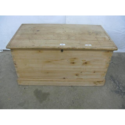 386 - Pine blanket box having a hinged lift top lid opening to storage with iron carrying handles, standin... 