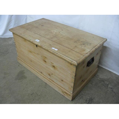 386 - Pine blanket box having a hinged lift top lid opening to storage with iron carrying handles, standin... 