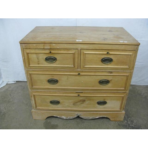 387 - Pine chest of two short over two long graduated drawers, standing on a shaped plinth base with appli... 