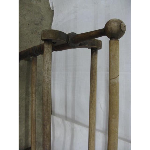 390 - Beech towel rail having four hanging railed united by barley twist supports, standing on splayed fee... 