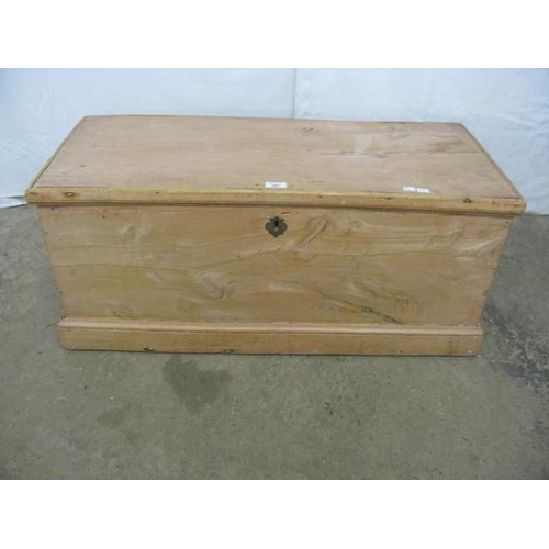 391 - Pine blanket box having a hinged lift top lid opening to a candle box and storage, standing on a pli... 