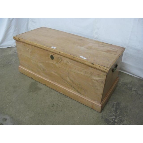 391 - Pine blanket box having a hinged lift top lid opening to a candle box and storage, standing on a pli... 