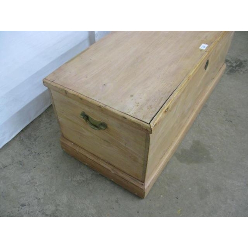 391 - Pine blanket box having a hinged lift top lid opening to a candle box and storage, standing on a pli... 