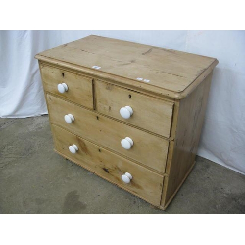 392 - Pine chest of two short over two long drawers, standing on block feet - 82cm x 46cm x 70cm tall