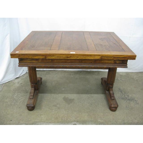 399 - Oak draw leaf table having carved frieze decoration, standing on trestle supports with stretcher - 1... 