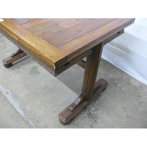 399 - Oak draw leaf table having carved frieze decoration, standing on trestle supports with stretcher - 1... 