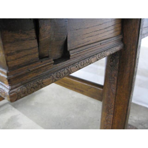 399 - Oak draw leaf table having carved frieze decoration, standing on trestle supports with stretcher - 1... 