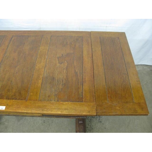 399 - Oak draw leaf table having carved frieze decoration, standing on trestle supports with stretcher - 1... 