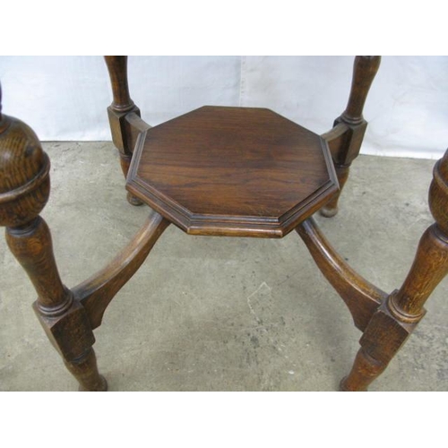 400 - Oak octagonal top centre table having an octagonal lower tier united by turned supports - 69cm x 67c... 