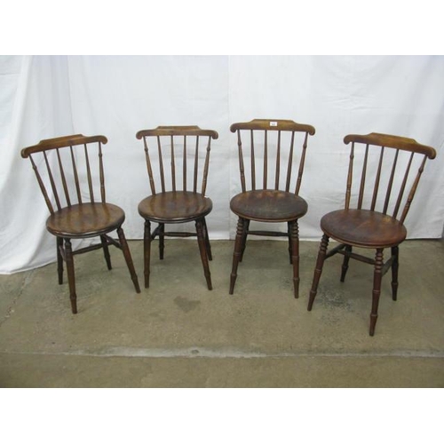 402 - Two pairs of penny seat kitchen chairs having stick backs, standing on turned legs with stretchers -... 