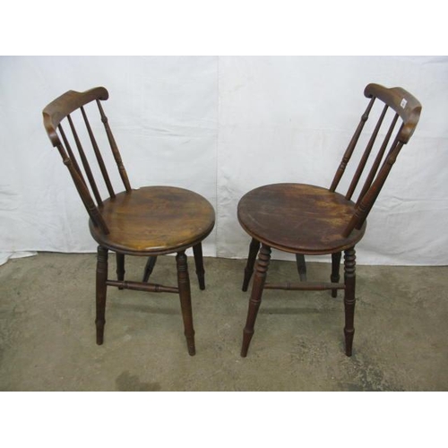 402 - Two pairs of penny seat kitchen chairs having stick backs, standing on turned legs with stretchers -... 