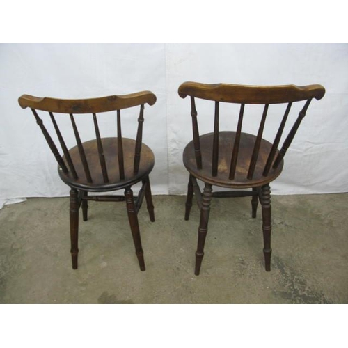 402 - Two pairs of penny seat kitchen chairs having stick backs, standing on turned legs with stretchers -... 